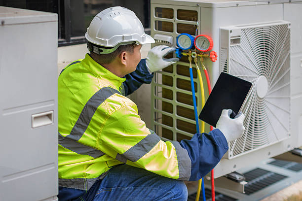 Professional Air Conditioning Repair technician working in Grinnell, IA